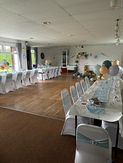 Function hall dressed using hirer’s own seat covers for a christening